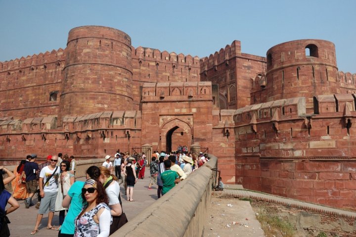 Crowd of tourists are entering the famous Agra Fort - the old Mughal Empire capital and a UNESCO World Heritage Site