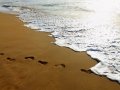 Footprints on the beach sand on Chennai beach.