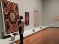 A visitor looks at quilts at the Queensland Art Gallery, Brisbane, Queensland, Australia (Source abc.net.au)